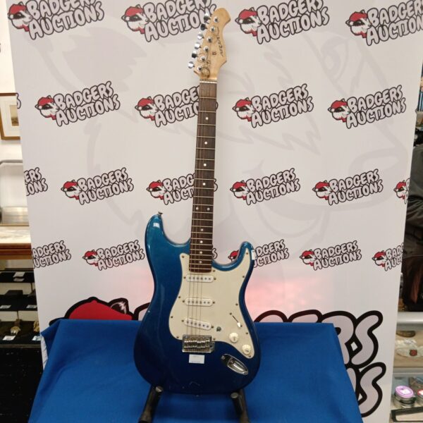 Vintage blue Aria electric guitar needing restoration.