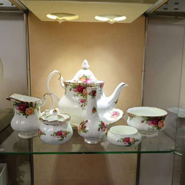 Royal Albert Old Country Roses china collection featuring a teapot and creamer.
