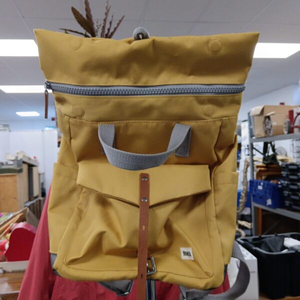 Front view of a yellow Roka backpack, ideal for outdoor adventures.