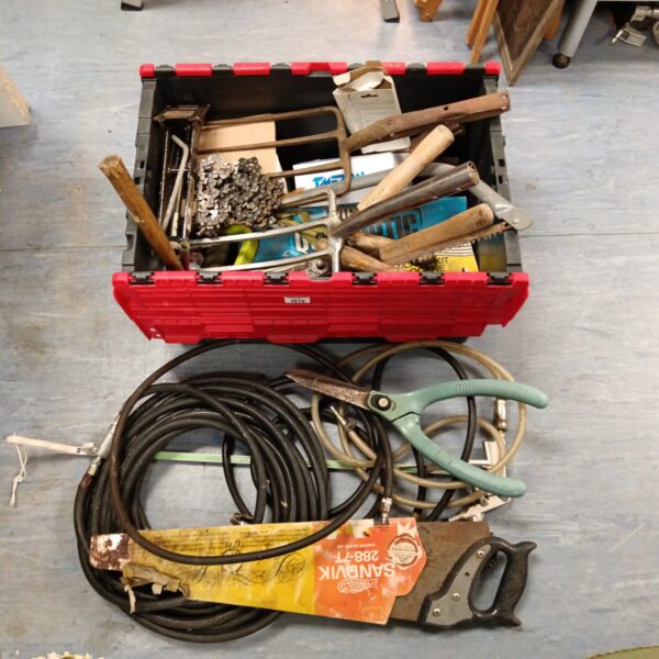Red plastic box filled with a mixed lot of vintage hand tools.