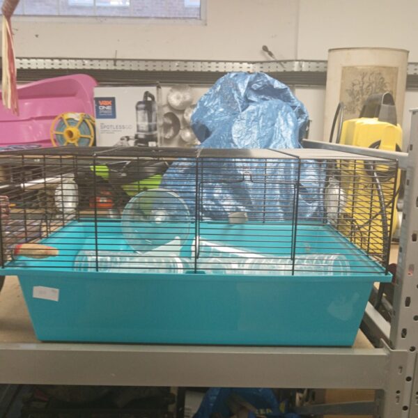 Blue plastic hamster cage with wire top, used condition.