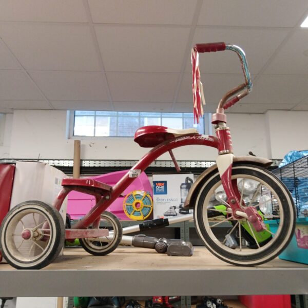 Vintage red Radio Flyer trike, classic children's ride-on toy.