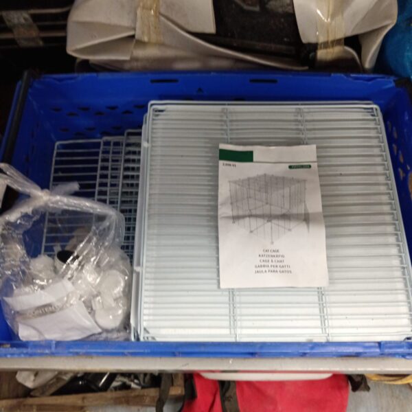 Wire folding cat cage for pet transport and storage.