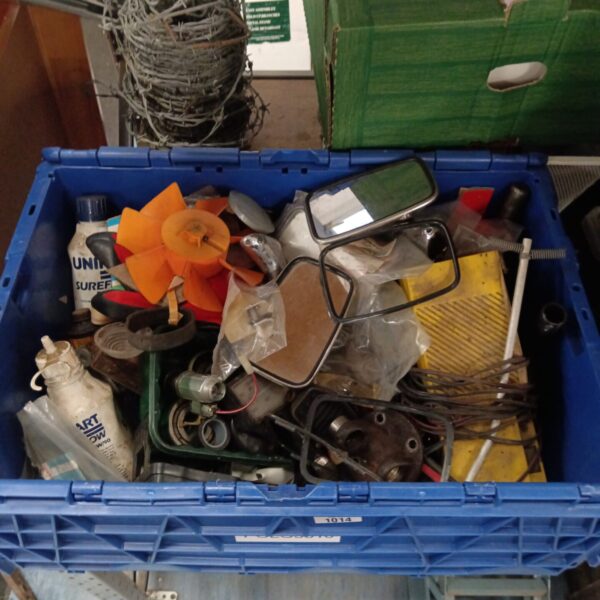Mixed lot of used car parts and chrome mirrors in a box.