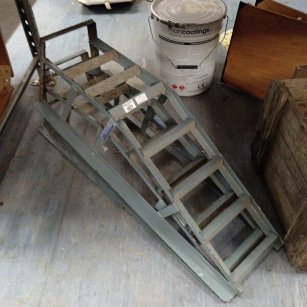 Pair of vintage Paddy Hopkirk car ramps for vehicle maintenance.