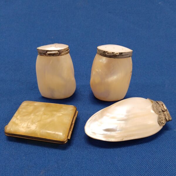 Antique mother of pearl vanity set with compact, salt and pepper pots.