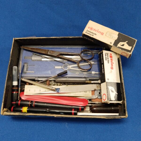 Vintage Rotring pens and stationery in a tray, ideal for collectors.