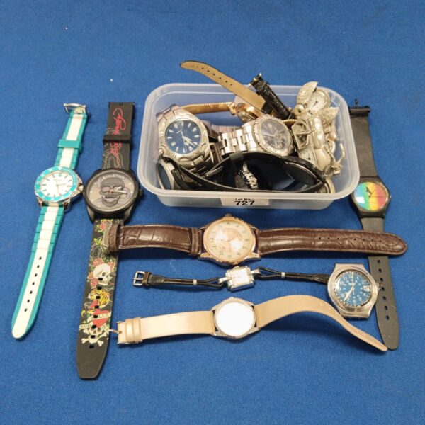 Mixed watch lot featuring Ed Hardy and Swatch brands.