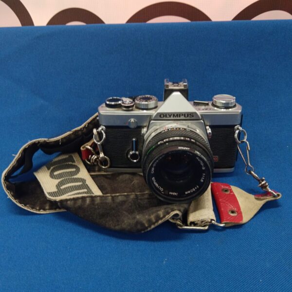 Front view of a vintage Olympus OM-1 35mm film camera.