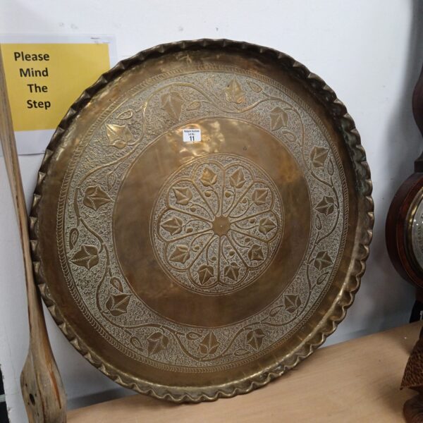 Large antique Islamic brass charger with intricate detailing.