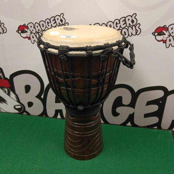 Toca bongo drum, a handheld percussion instrument.