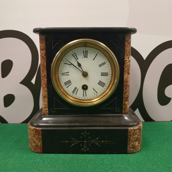 Antique Victorian slate mantle clock with marble details.