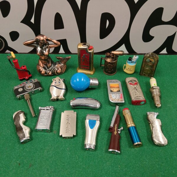 Group of vintage novelty lighters, collectible display pieces.