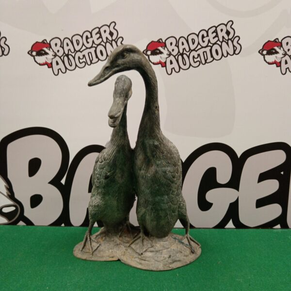 Vintage metal duck ornament for garden or home decor.