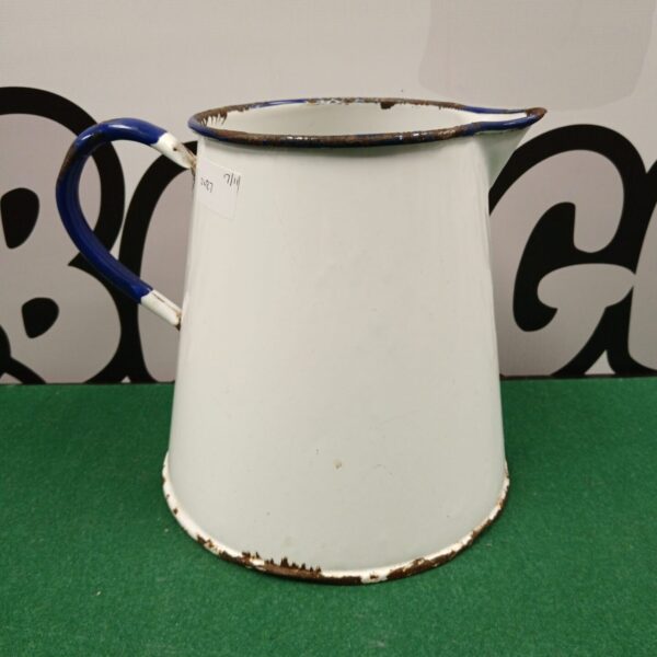 Large vintage enamel jug with a creamy white finish.