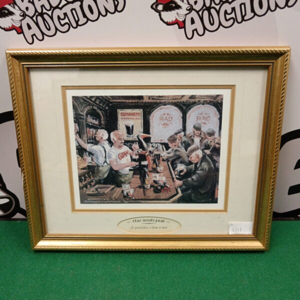 Vintage Guinness print of a lively Irish pub scene.