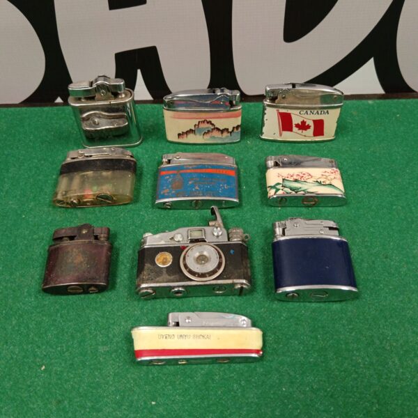 Collection of vintage gas lighters with decorative designs.