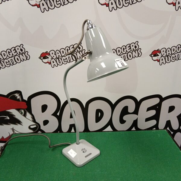 Grey Anglepoise lamp with adjustable swan neck for desk lighting.