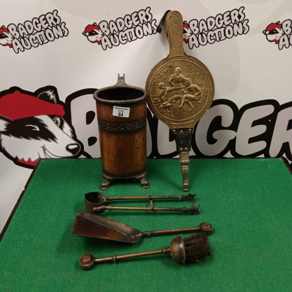 Antique fireplace companion set with copper tools and brass bellows.