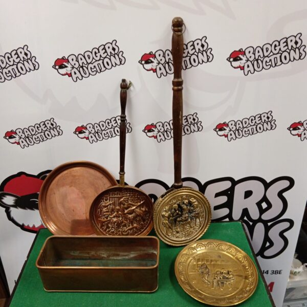 Vintage brass and copper tray with mixed metalware pieces.