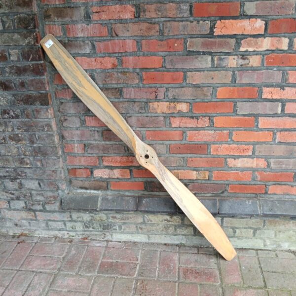 Vintage wooden propeller blade, model 62, for aircraft enthusiasts.