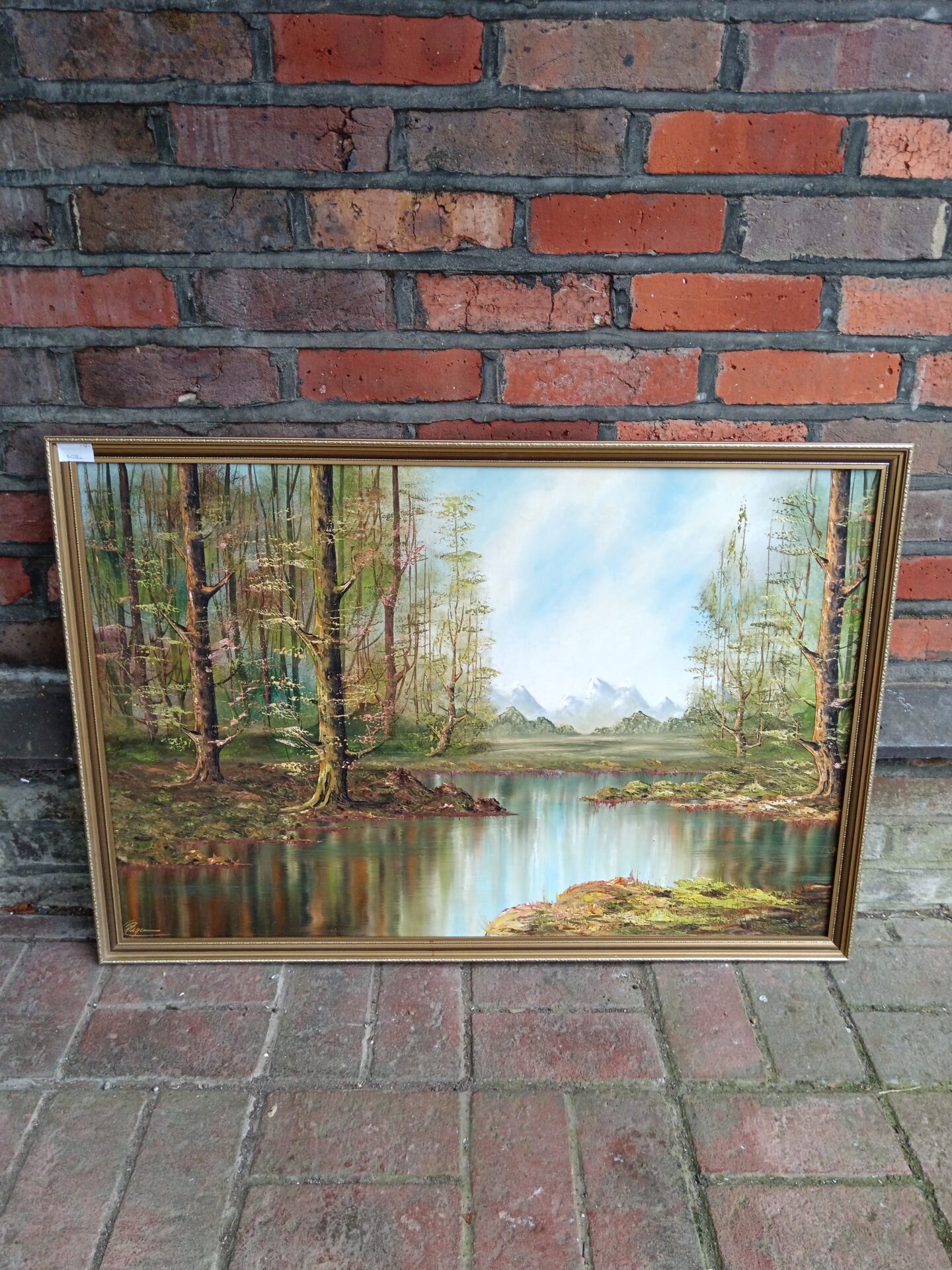 725 Large signed oil painting of a woodland lake with mountains