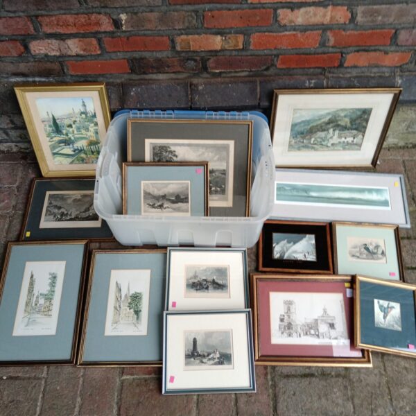 Collection of framed prints and engravings for vintage wall decor.
