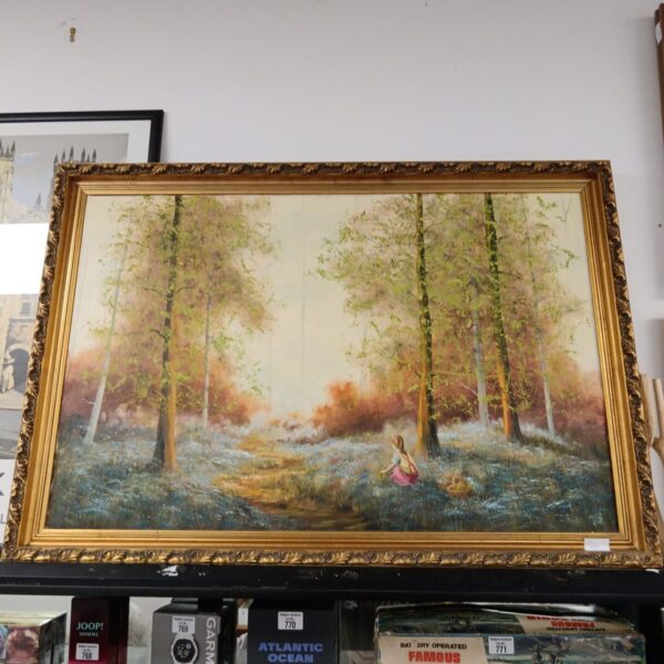 Large gilt framed oil painting of girl picking flowers in forest.