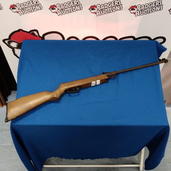 Vintage Asi Range Master .22 caliber air rifle with wooden stock.
