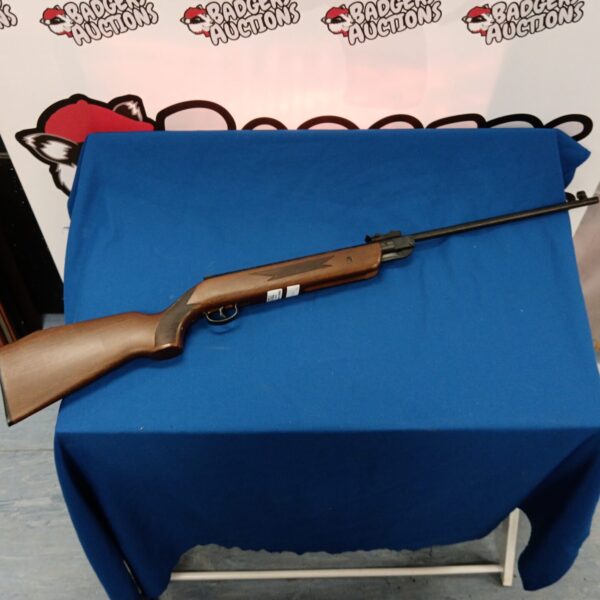 Vintage Westpeake .22 caliber air rifle with wooden stock.