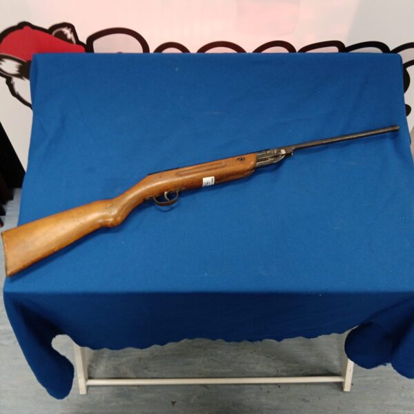 Vintage Haenel air rifle with wooden stock, ideal for collectors.