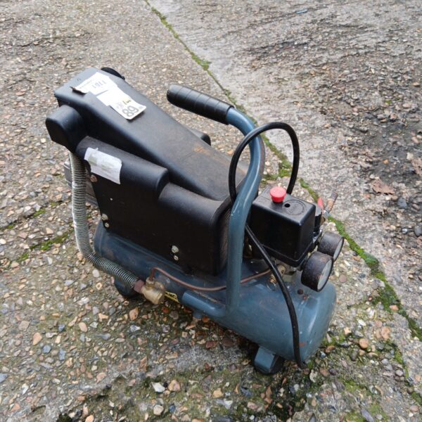 Side view of a small hobby air compressor for DIY projects.