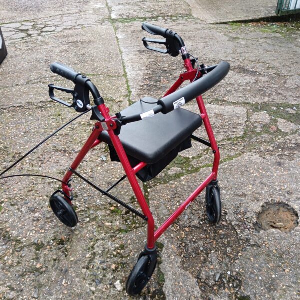 Red Drive folding mobility walker with padded seat.