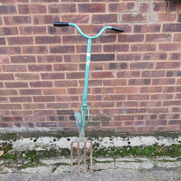 Vintage garden fork with foot pedal for digging.