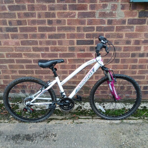 White and pink Muddyfox Trinity girls mountain bike.