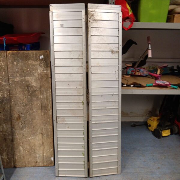 Pair of large aluminium folding ramps for loading and unloading.