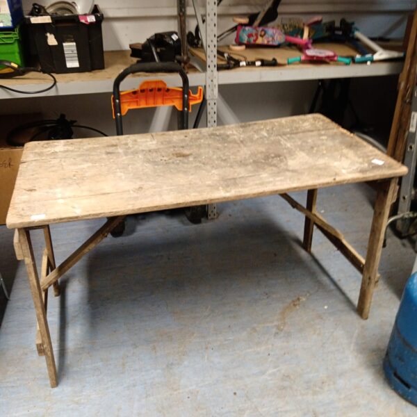 Vintage wooden folding table with rustic charm.