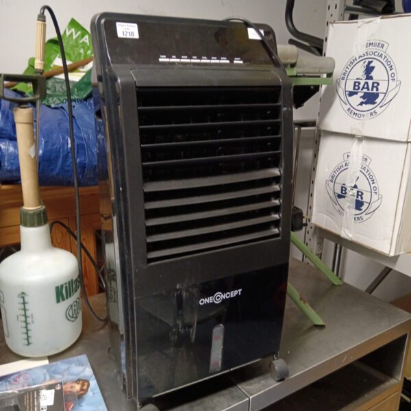 Side view of a used One Concept portable dehumidifier.