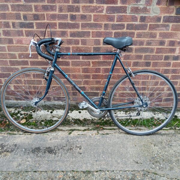 Side view of a vintage Brinkmann racer bike in good condition.