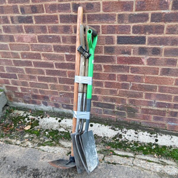 Dobbies garden fork and shovel set for gardening tasks.