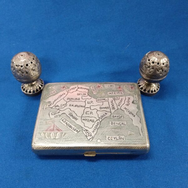 Antique Indian white metal incense pots with intricate detailing.