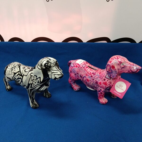 Two designer ceramic dogs with graffiti designs.