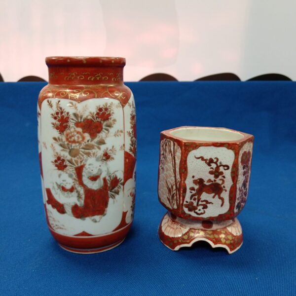 Antique Japanese Kutani brush pots with detailed figure designs.