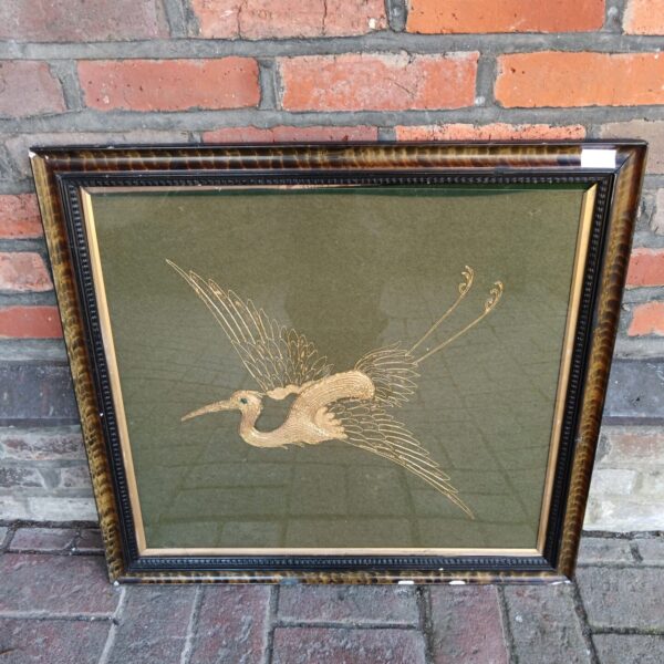 Vintage embroidered crane wall hanging with gold thread detail.