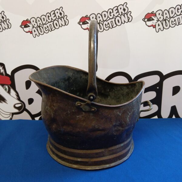 Antique copper helmet coal scuttle, vintage fireplace accessory.