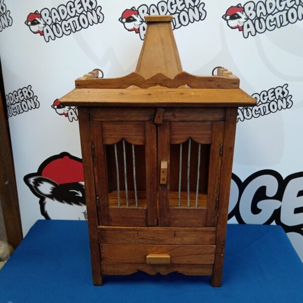 Intricately carved Hindu teak wood temple cabinet with drawers.