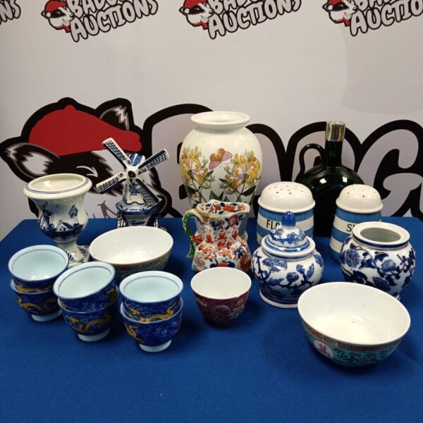 Assortment of oriental and Delft china pieces on display.