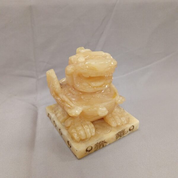 Antique Chinese carved stone dragon sculpture, detailed and collectible.
