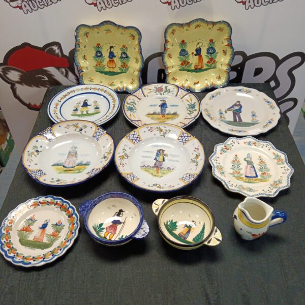Vintage Quimper pottery collection featuring hand-painted Breton figures.