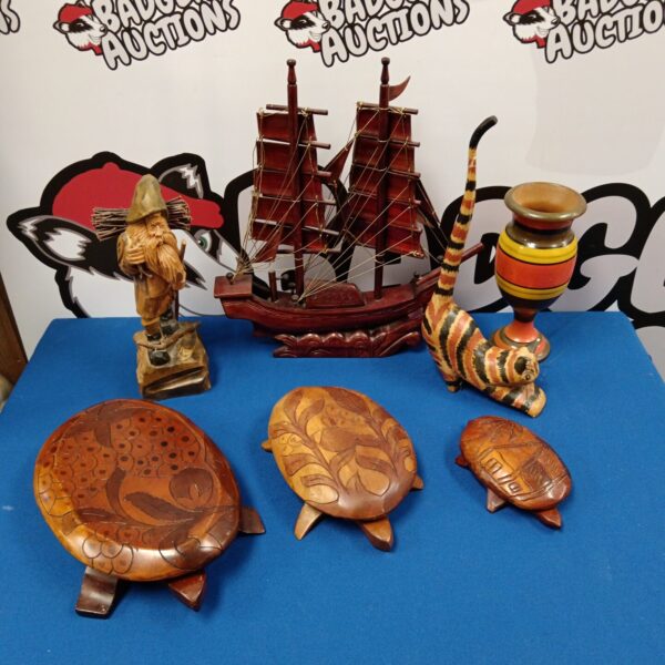 Collection of three hand-carved wooden turtle pots, decorative folk art.